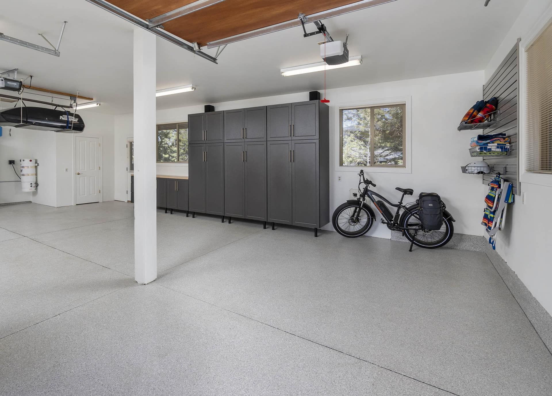 Before and After Garage Organization Solutions image 1 showing custom powder coated garage cabinets and storage details