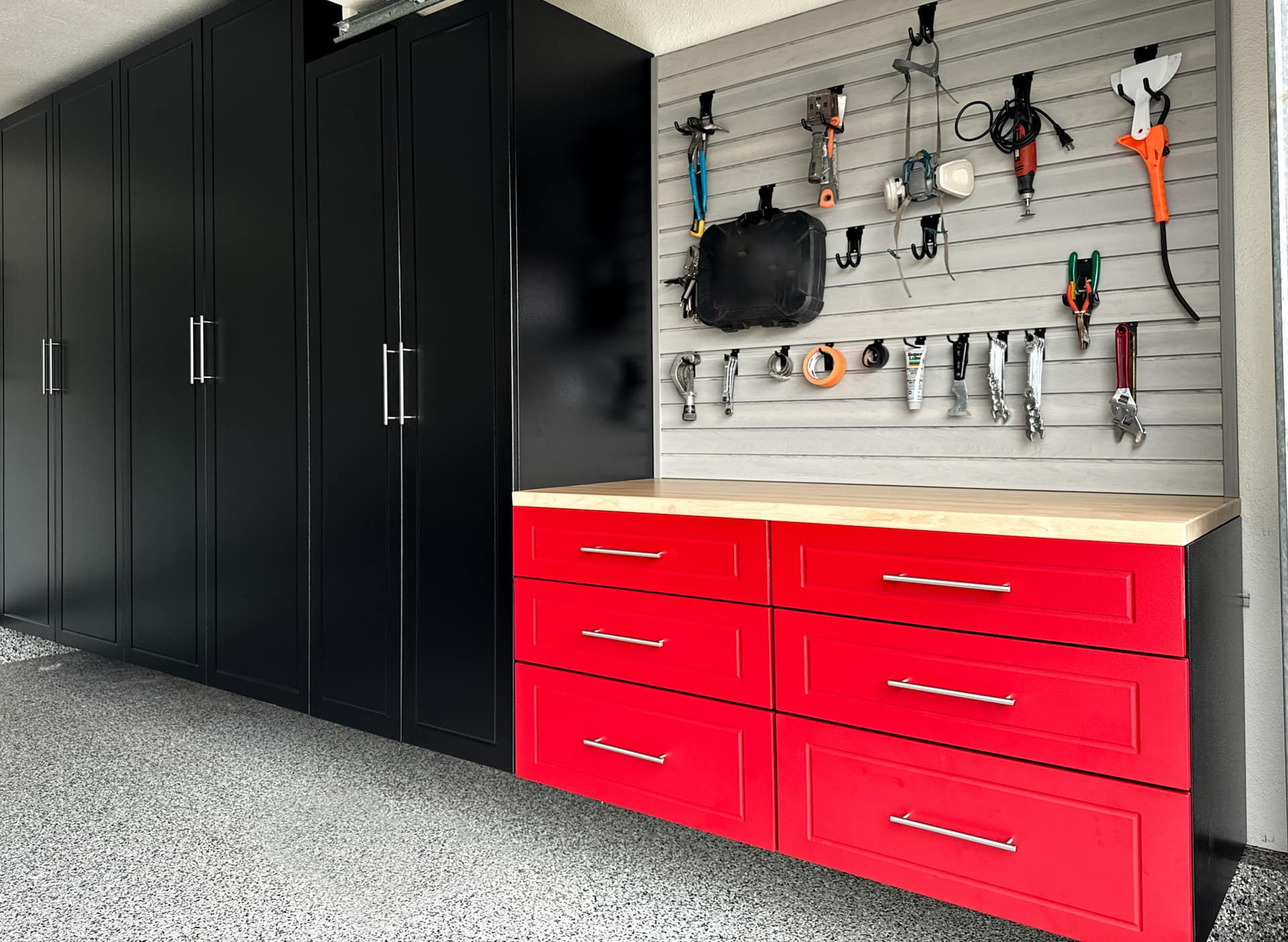 Premium custom garage cabinet dealer installation with powder coated red cabinet finish