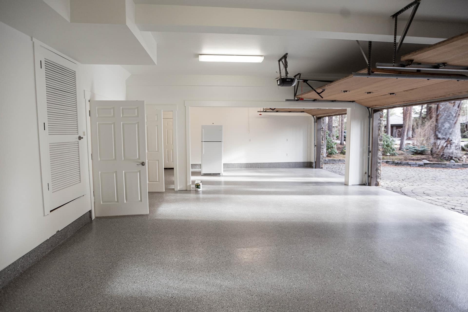 White Built-to-Order Garage Cabinets image 1 showing custom powder coated garage cabinets and storage details